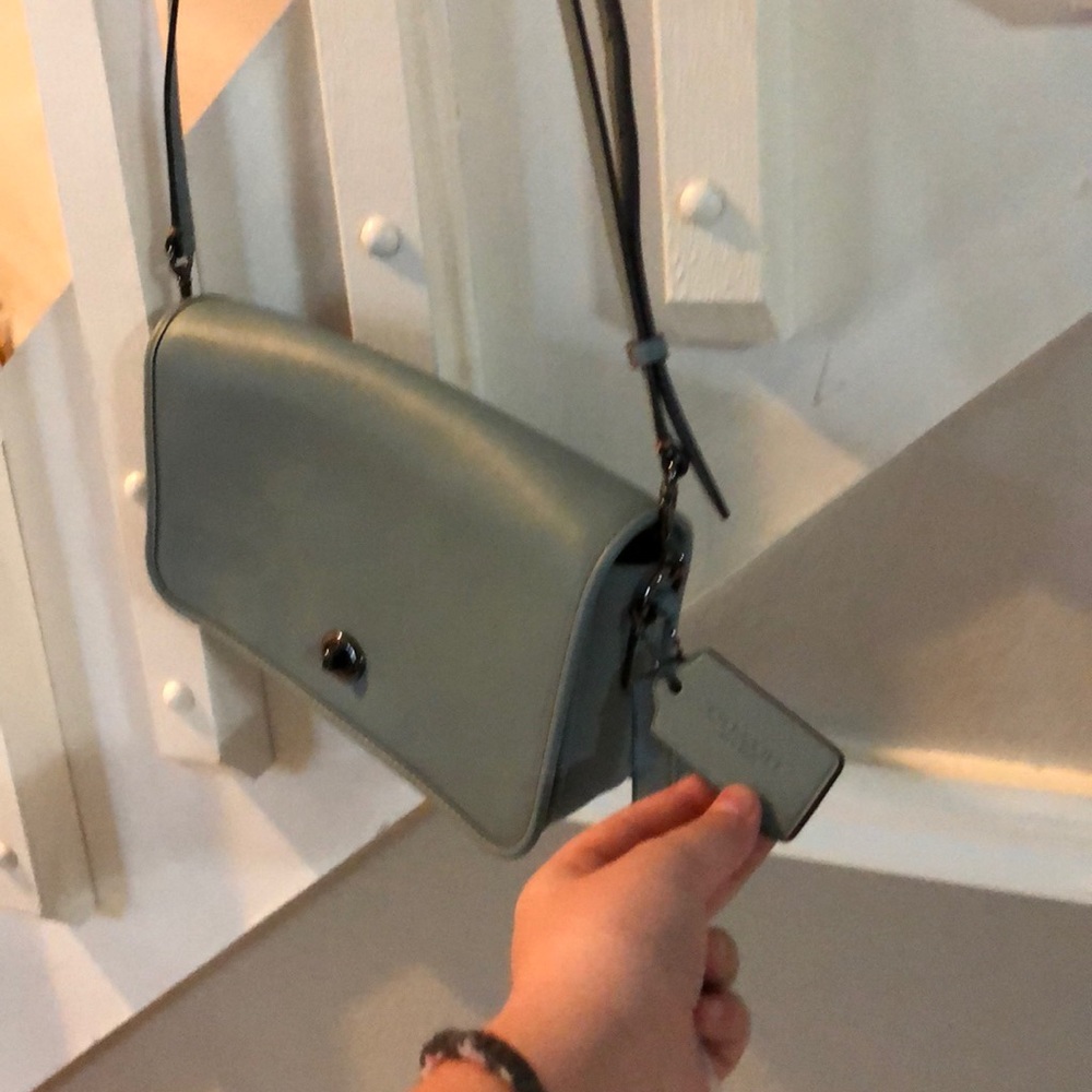 A blue coach purse ,bag to hold